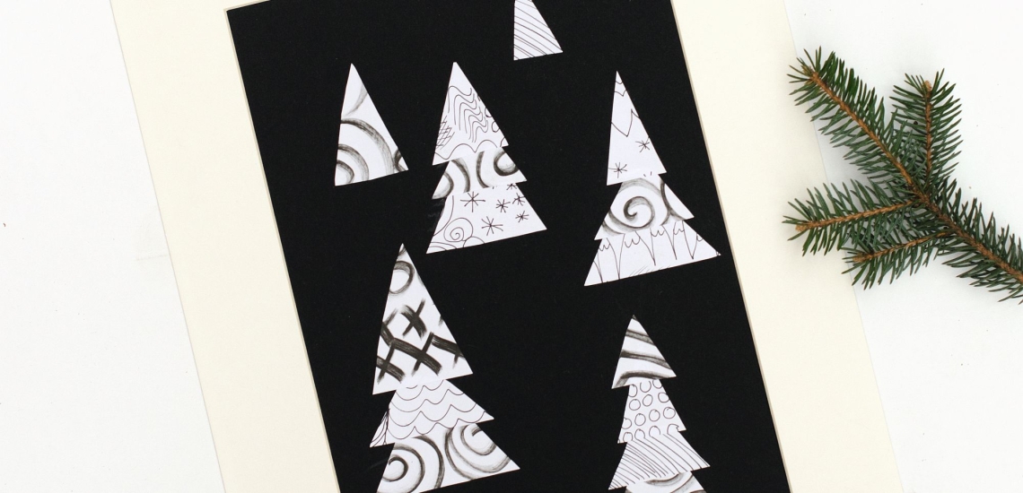 gemusterte Tannen auf schwarzem Papier mit Tannenzweig 