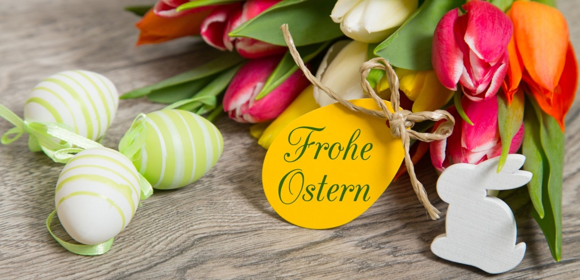 Tulpen Ostereier Osterhase und Spruch Frohe Ostern 