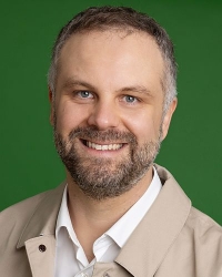 Porträt Christian Huber Mann mit Bart