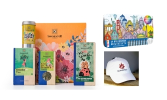 Lebensmittel aus Glücksbox, Buntstifte-Packung und Kappe mit Don Bosco Logo